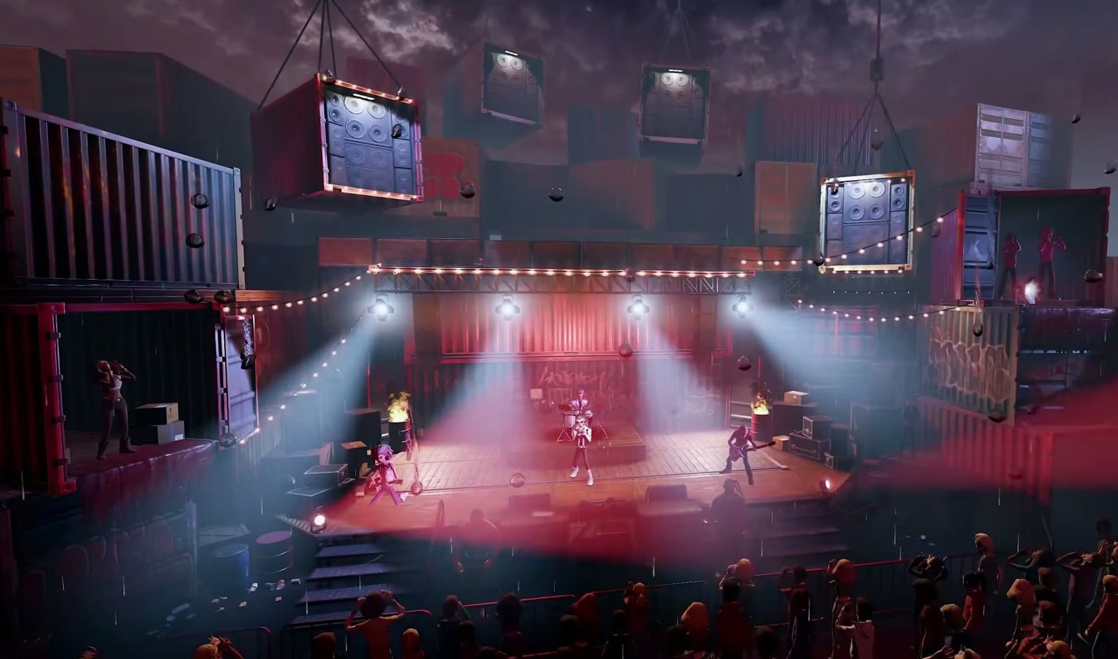A stage built from shipping containers in front of a crowd in Stage Tour